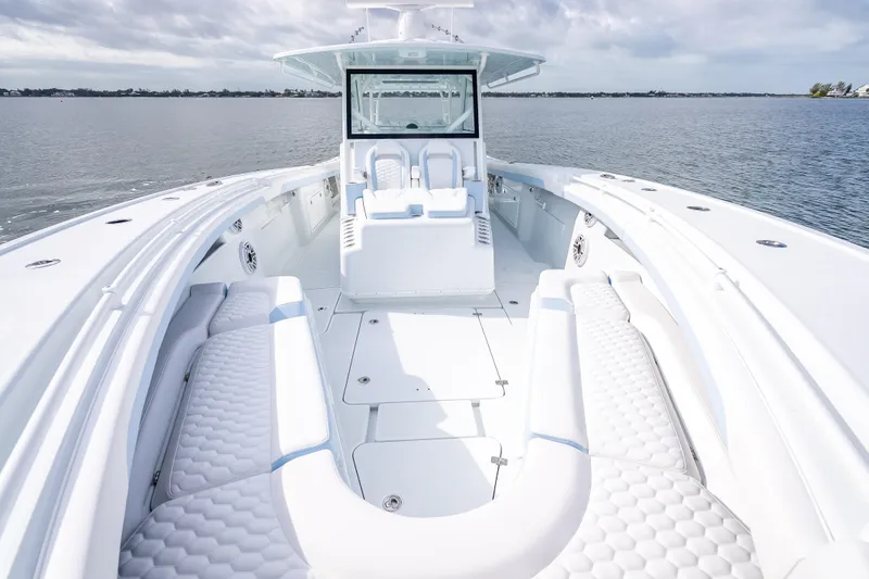 Slide: The Image of 2026 Yellowfin 42 Offshore boat with luxurious seating on calm waters. - 27