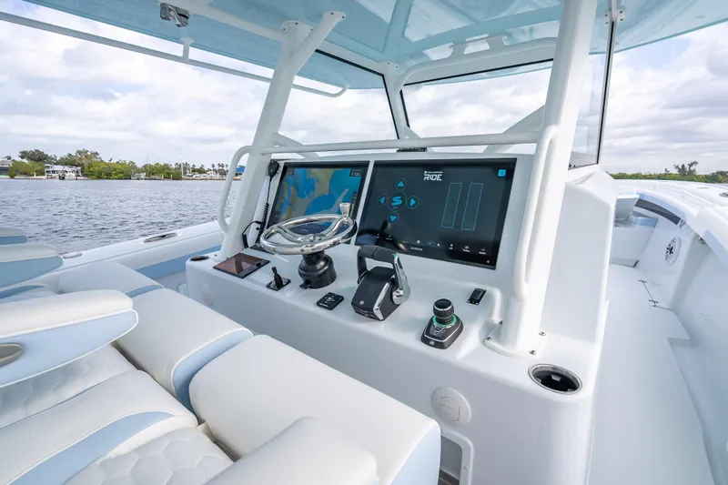 Slide: The Image of 2026 Yellowfin 42 Offshore boat cockpit with advanced navigation system and luxurious seating. - 28