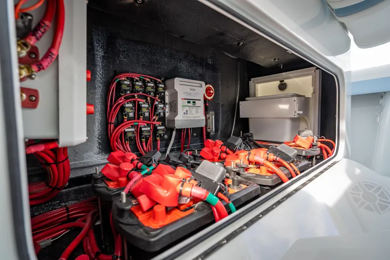 Slide: The Image of Electrical system of 2026 Yellowfin 42 Offshore boat, featuring red wiring and battery setup. - 30