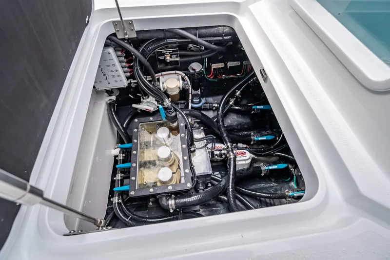 Slide: The Image of Engine compartment of 2026 Yellowfin 42 Offshore boat, showcasing intricate wiring and components. - 32
