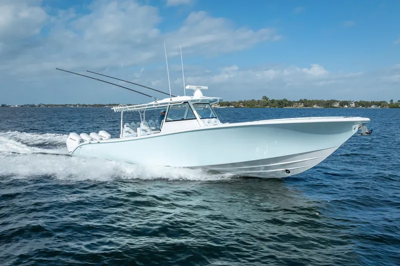 Slide: The Image of 2026 Yellowfin 42 Offshore boat cruising on open water under a clear sky. - 4