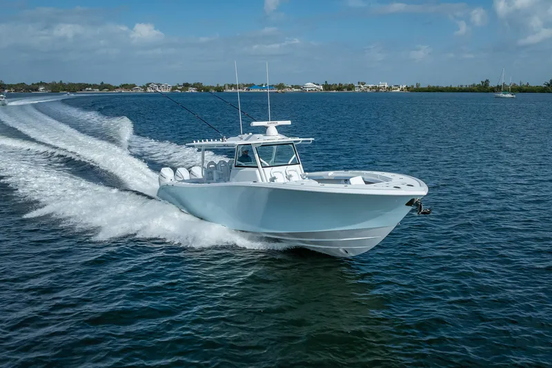 Slide: The Image of 2026 Yellowfin 42 Offshore boat cruising on open water under clear skies. - 6