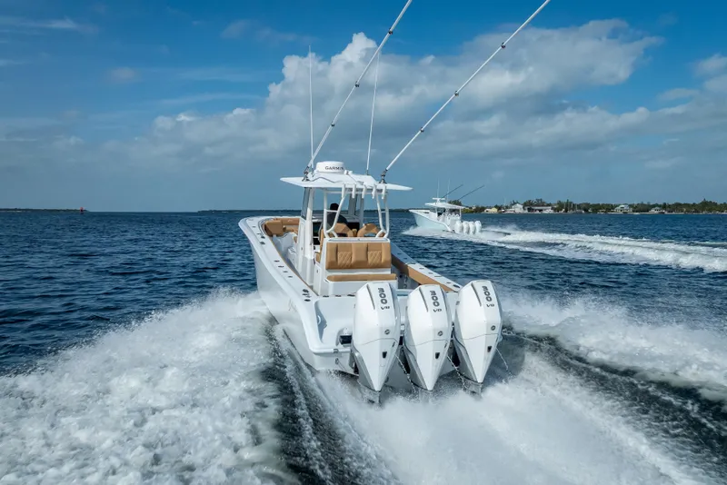 Slide: The Image of 2026 Yellowfin 42 Offshore boat cruising on open water, showcasing powerful engines. - 7