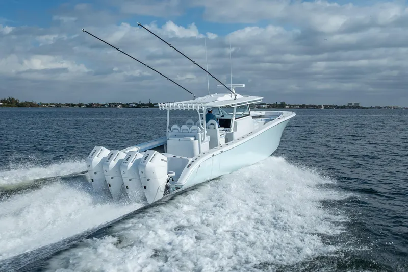 Slide: The Image of 2026 Yellowfin 42 Offshore boat cruising on open water with four engines. - 8