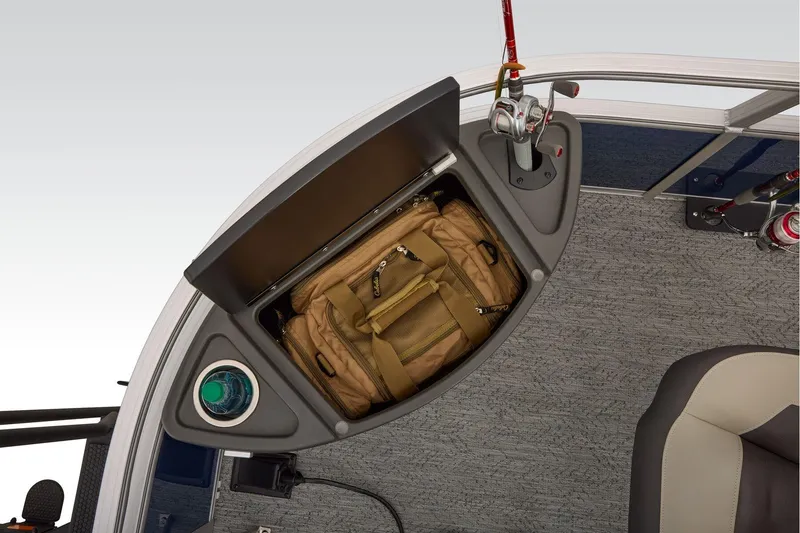 Slide: The Image of Manufacturer Provided Image: Storage compartment on 2026 Sun Tracker Bass Buggy 18 DLX with fishing gear and backpack. - 28
