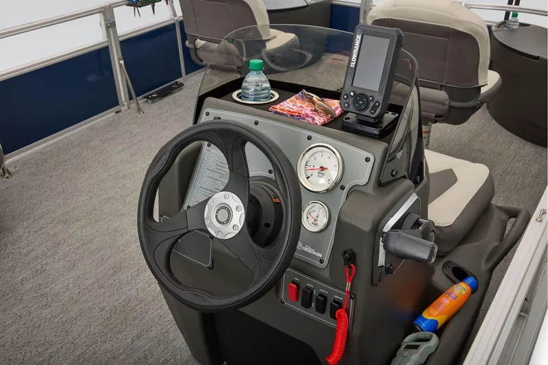 Slide: The Image of Manufacturer Provided Image: 2026 Sun Tracker Bass Buggy 18 DLX dashboard with steering wheel and navigation equipment. - 36