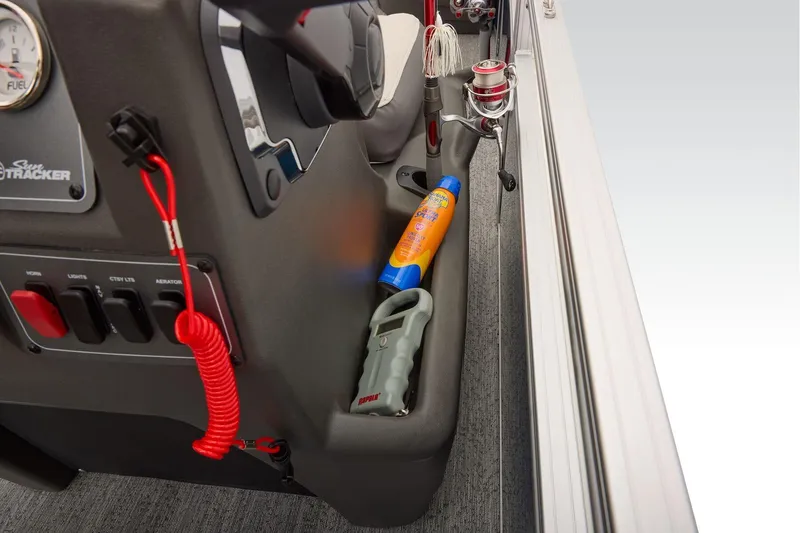 Slide: The Image of Manufacturer Provided Image: 2026 Sun Tracker Bass Buggy 18 DLX boat console with fishing gear and sunscreen. - 41