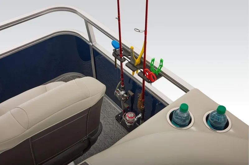 Slide: The Image of Manufacturer Provided Image: 2026 Sun Tracker Bass Buggy 18 DLX interior with fishing rods and cup holders. - 51