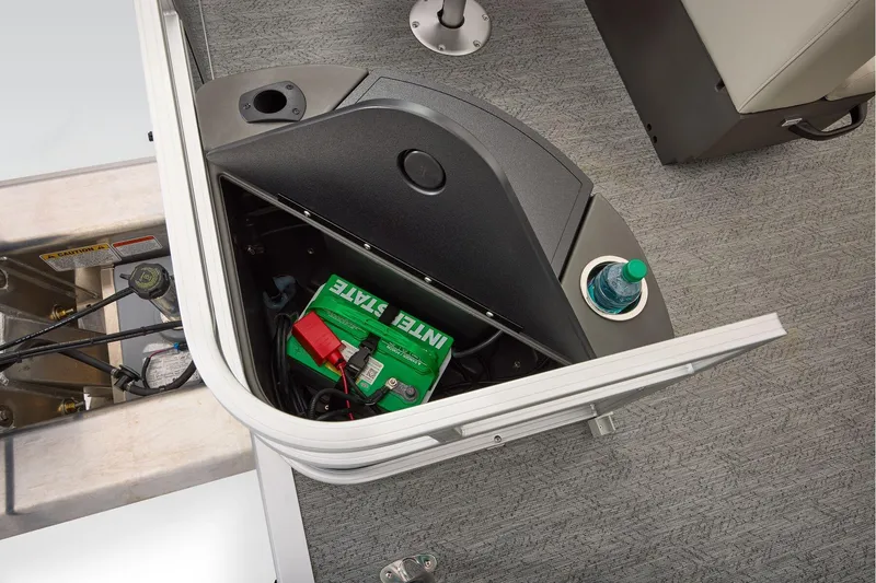 Slide: The Image of Manufacturer Provided Image: 2026 Sun Tracker Bass Buggy 18 DLX boat battery compartment with storage and cup holder. - 55