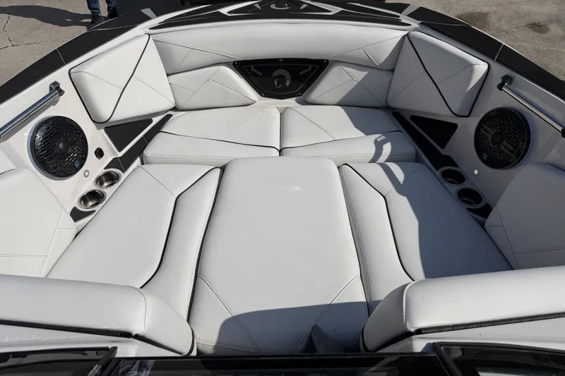 Slide: The Image of Luxurious interior of 2026 Centurion Nv233 boat with white leather seating and speakers. - 14