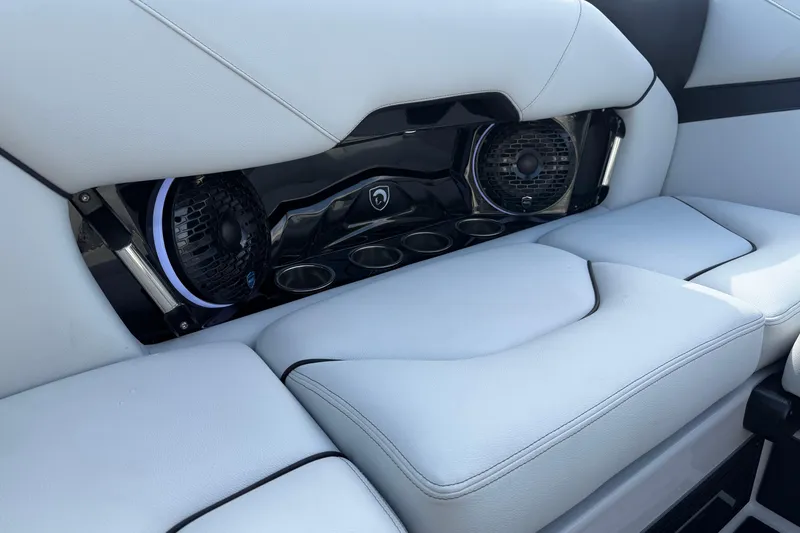 Slide: The Image of 2026 Centurion Nv233 interior with sleek white seating and integrated speakers. - 16