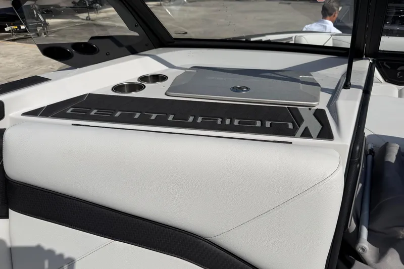 Slide: The Image of 2026 Centurion Nv233 boat interior with logo and cup holders. - 18