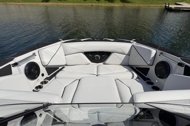 Slide: The Image of Luxurious interior of 2026 Centurion Nv233 boat with white seating and speakers. - 22