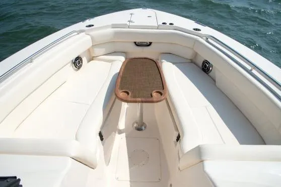Slide: The Image of 2016 Grady-White Freedom 307 boat interior with white seating and dashboard view. - 20