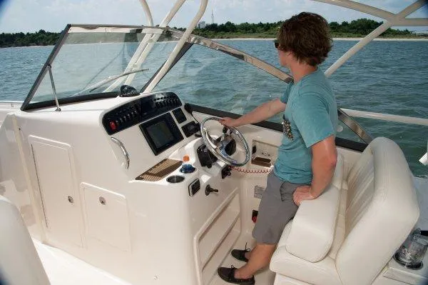 Slide: The Image of 2016 Grady-White Freedom 307 boat interior with open storage compartments. - 22