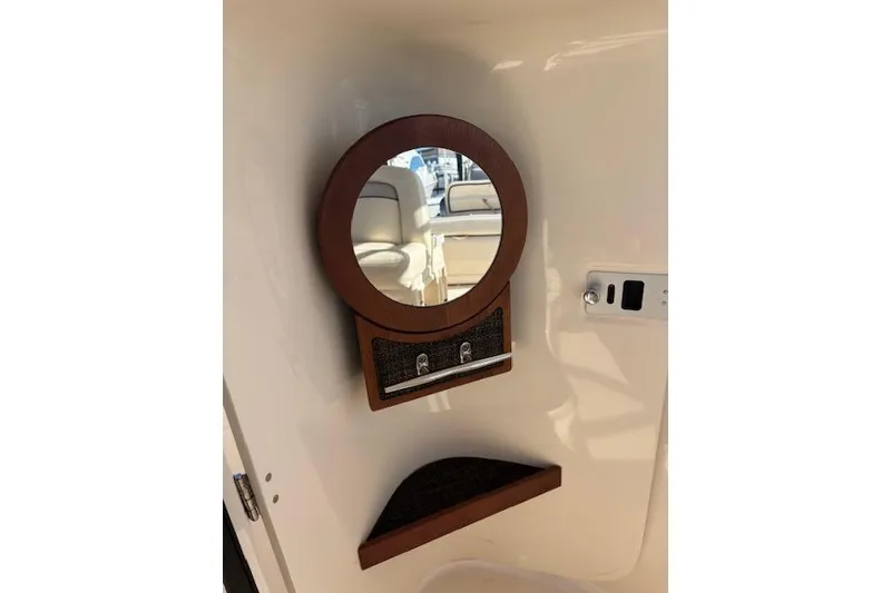 Slide: The Image of 2016 Grady-White Freedom 307 boat interior with sink and storage compartment. - 23