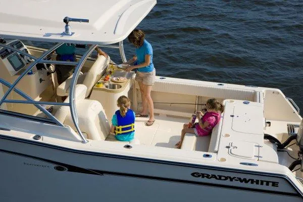 Slide: The Image of 2016 Grady-White Freedom 307 boat interior with spacious seating and sleek design. - 6