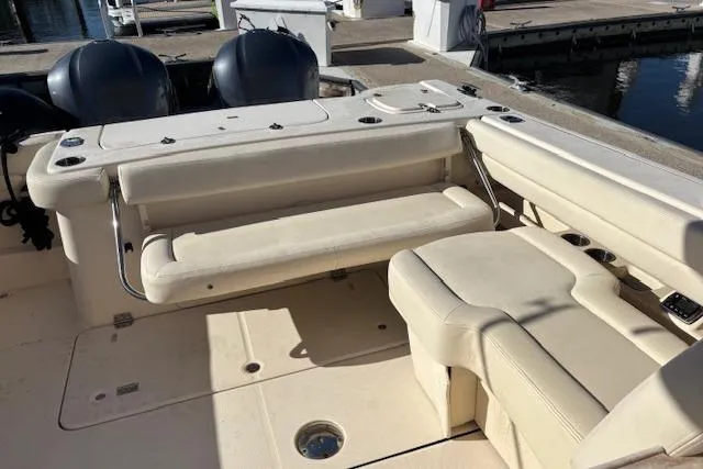 Slide: The Image of 2016 Grady-White Freedom 307 boat interior with comfortable seating and storage features. - 7