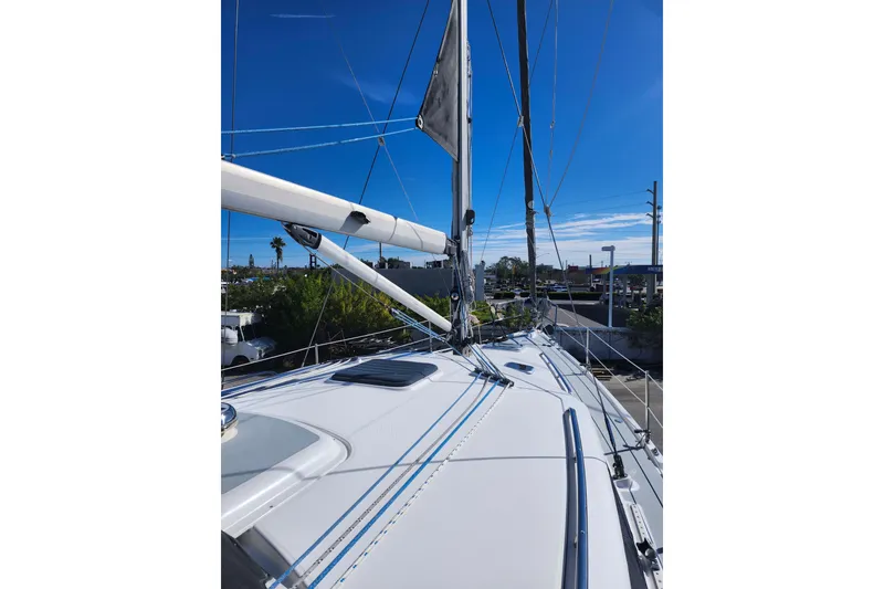 Slide: The Image of Sailboat deck view of 2003 Hunter 426 Deck Salon under clear blue sky. - 11