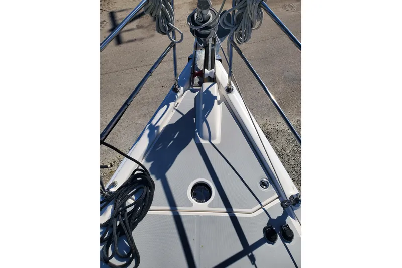 Slide: The Image of Bow view of 2003 Hunter 426 Deck Salon sailboat with ropes and railings. - 17