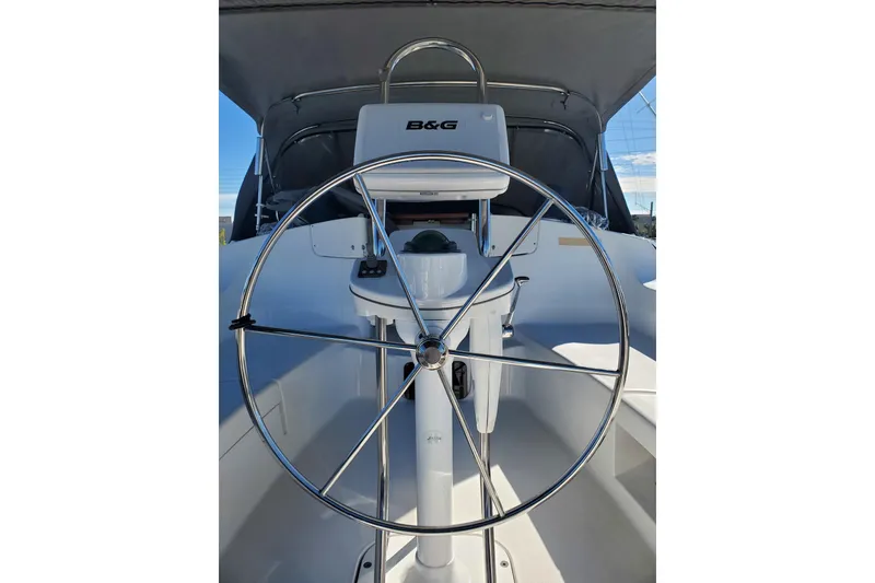 Slide: The Image of Steering wheel of 2003 Hunter 426 Deck Salon sailboat, featuring B&G navigation system. - 20
