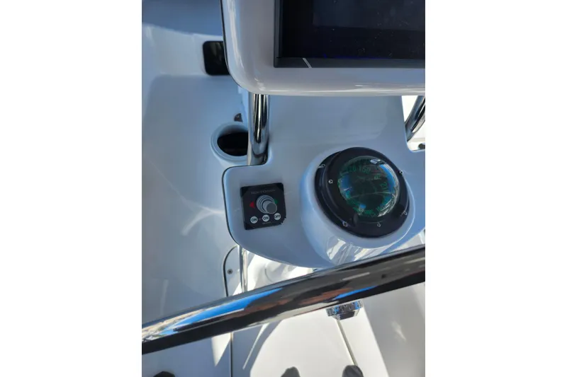 Slide: The Image of 2003 Hunter 426 Deck Salon yacht cockpit with compass and control panel. - 24