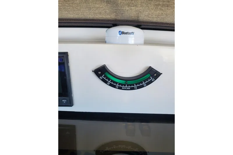 Slide: The Image of Control panel of 2003 Hunter 426 Deck Salon with Bluetooth and Ritchie compass. - 29