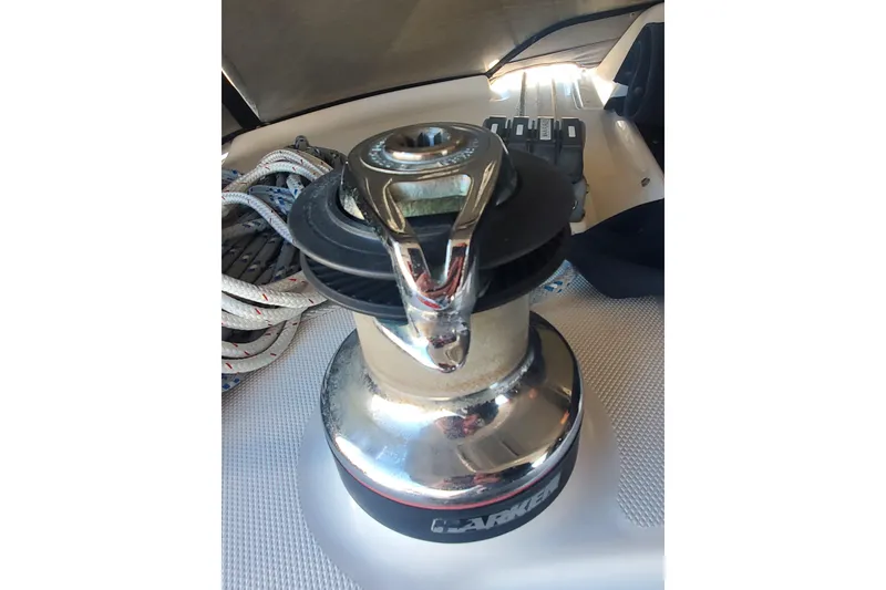 Slide: The Image of Winch on 2003 Hunter 426 Deck Salon sailboat, with coiled ropes nearby. - 33