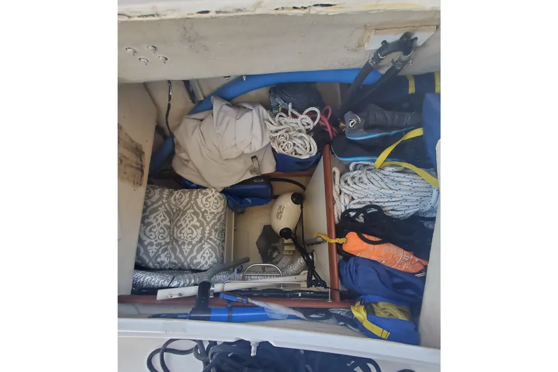 Slide: The Image of Storage compartment of 2003 Hunter 426 Deck Salon yacht with ropes and equipment. - 41