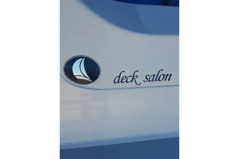 Slide: The Image of 2003 Hunter 426 Deck Salon logo and emblem on boat exterior. - 42