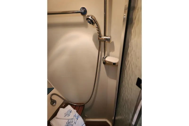 Slide: The Image of Shower area in 2003 Hunter 426 Deck Salon yacht with handheld showerhead. - 61