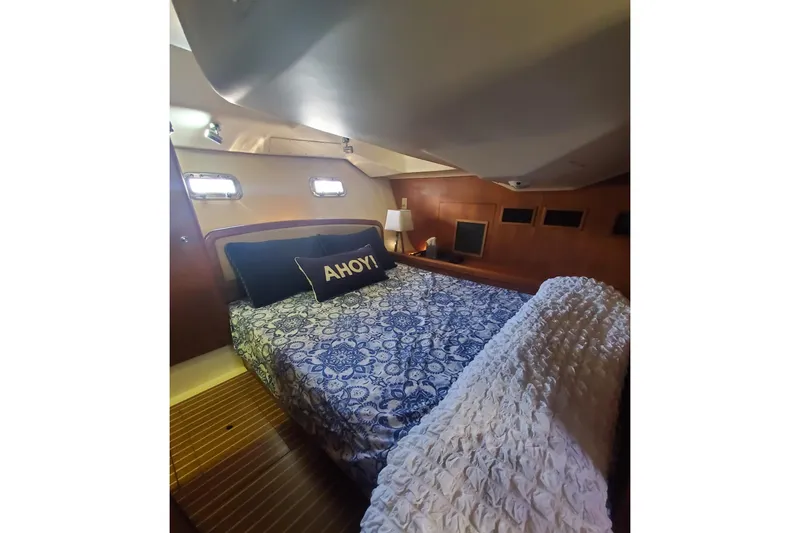 Slide: The Image of Luxurious cabin interior of 2003 Hunter 426 Deck Salon with nautical decor. - 72