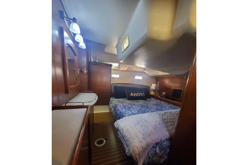Slide: The Image of Luxurious cabin interior of 2003 Hunter 426 Deck Salon yacht with cozy bedding. - 75