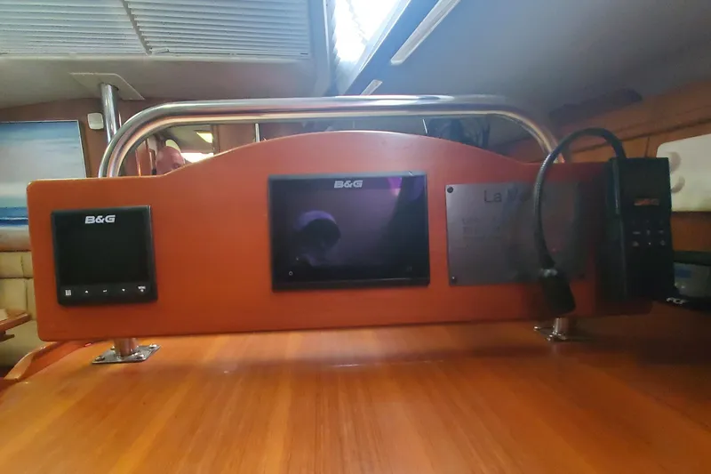 Slide: The Image of Control panel inside 2003 Hunter 426 Deck Salon yacht with B&G navigation equipment. - 82