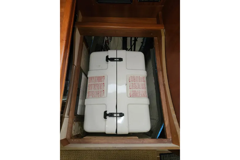 Slide: The Image of Storage compartment in 2003 Hunter 426 Deck Salon sailboat interior. - 86