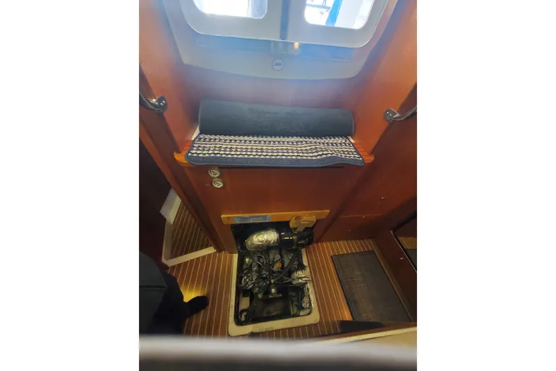 Slide: The Image of Engine compartment of 2003 Hunter 426 Deck Salon sailboat with wooden interior. - 87