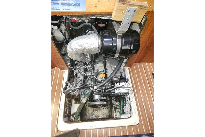 Slide: The Image of Engine compartment of a 2003 Hunter 426 Deck Salon sailboat, showing detailed components. - 89