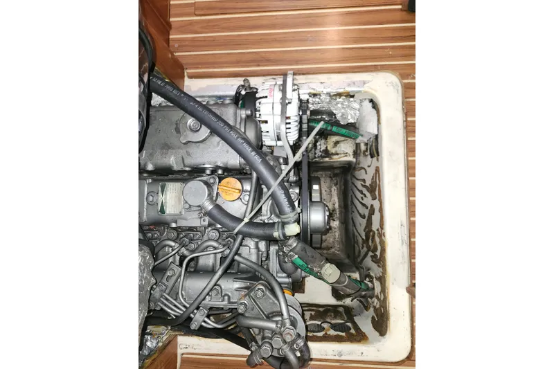 Slide: The Image of Engine compartment of 2003 Hunter 426 Deck Salon sailboat, showing mechanical components. - 90