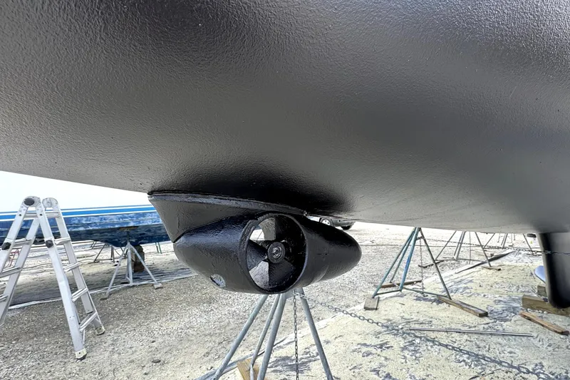 Slide: The Image of Bottom view of 2003 Hunter 426 Deck Salon sailboat with visible propeller and supports. - 97