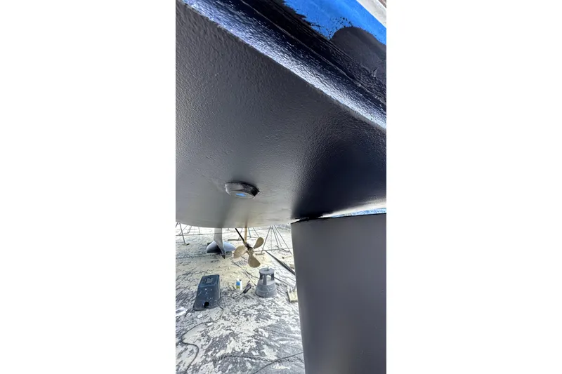 Slide: The Image of Bottom view of 2003 Hunter 426 Deck Salon sailboat, showing propeller and hull details. - 99