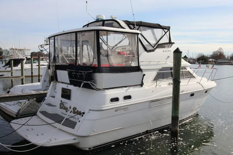 The Image of 1997 Cruisers Yachts 3650 Motoryacht docked in a marina, rear view. - 0
