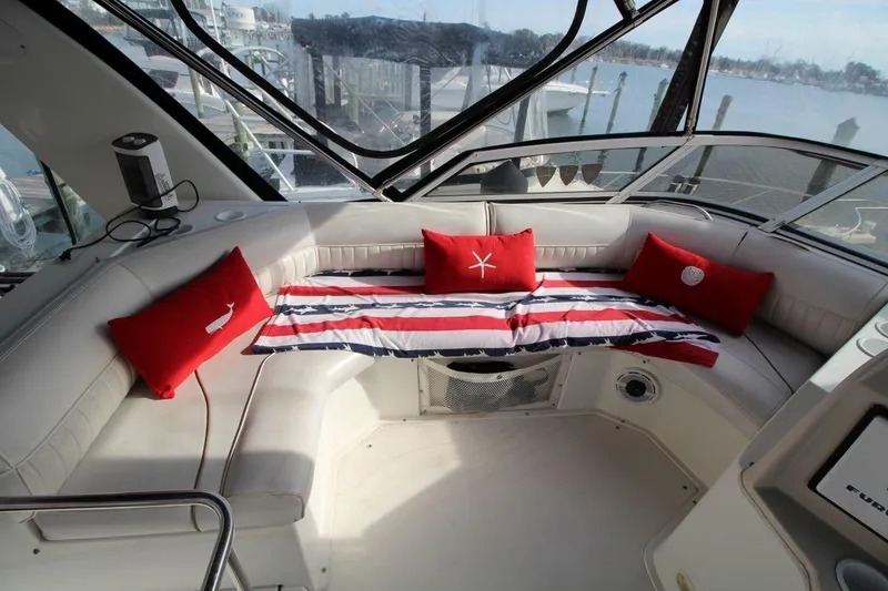 Slide: The Image of 1997 Cruisers Yachts 3650 Motoryacht interior with red cushions and striped decor. - 18