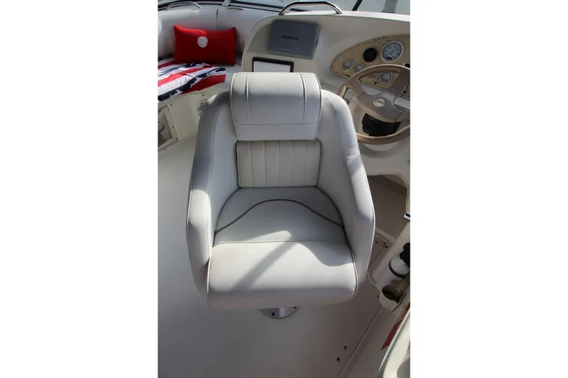 Slide: The Image of Captain's chair on 1997 Cruisers Yachts 3650 Motoryacht, featuring a sleek helm design. - 19