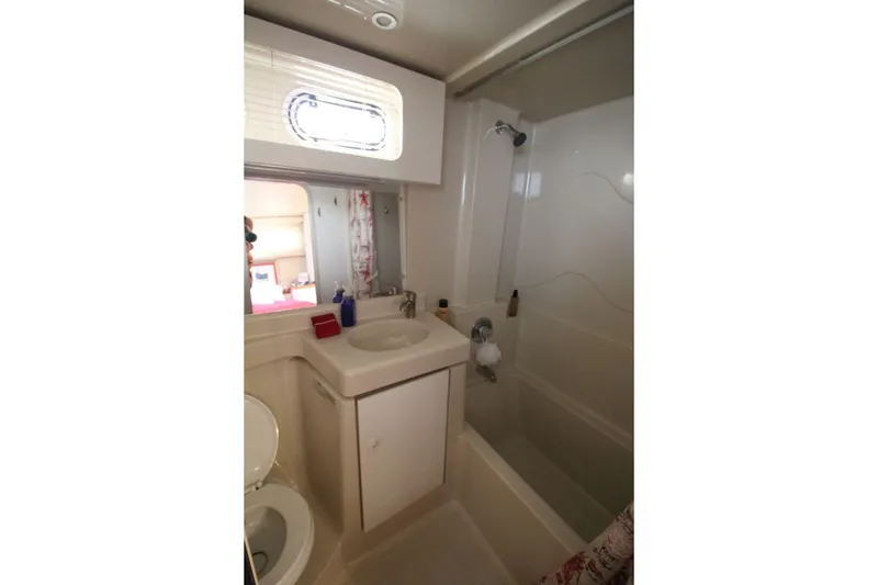 Slide: The Image of Bathroom interior of 1997 Cruisers Yachts 3650 Motoryacht, featuring sink and shower. - 28