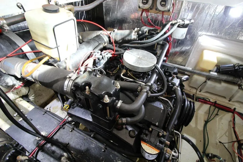 Slide: The Image of Engine room of 1997 Cruisers Yachts 3650 Motoryacht, showcasing detailed mechanical components. - 34
