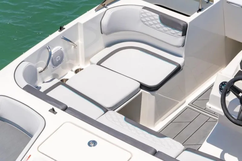 Slide: The Image of 2026 Bayliner M17 boat interior with modern seating and sleek design on water. - 4