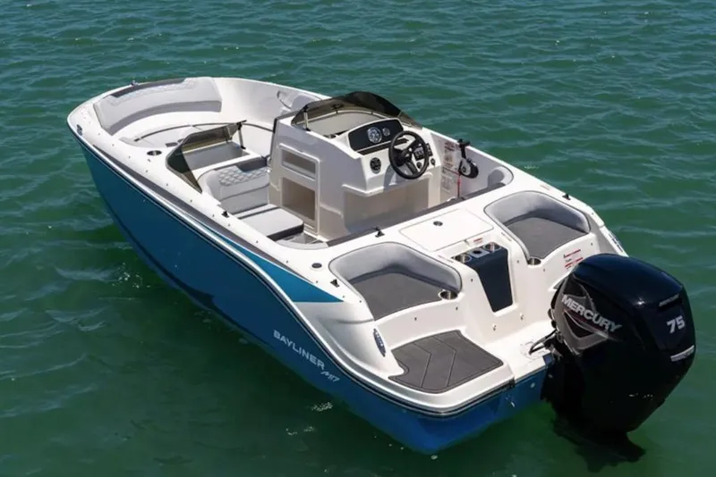 Slide: The Image of 2026 Bayliner M17 boat on water with Mercury 75 engine, featuring sleek design. - 5