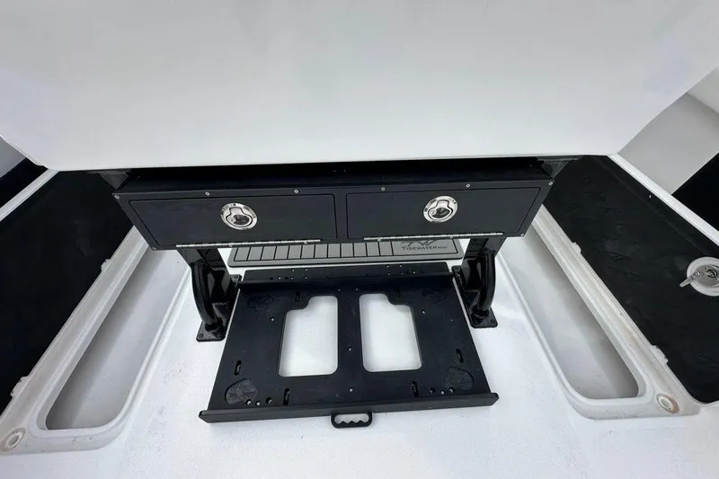 Slide: The Image of 2026 Tidewater 272 LXF boat interior with storage compartments and seating area. - 21