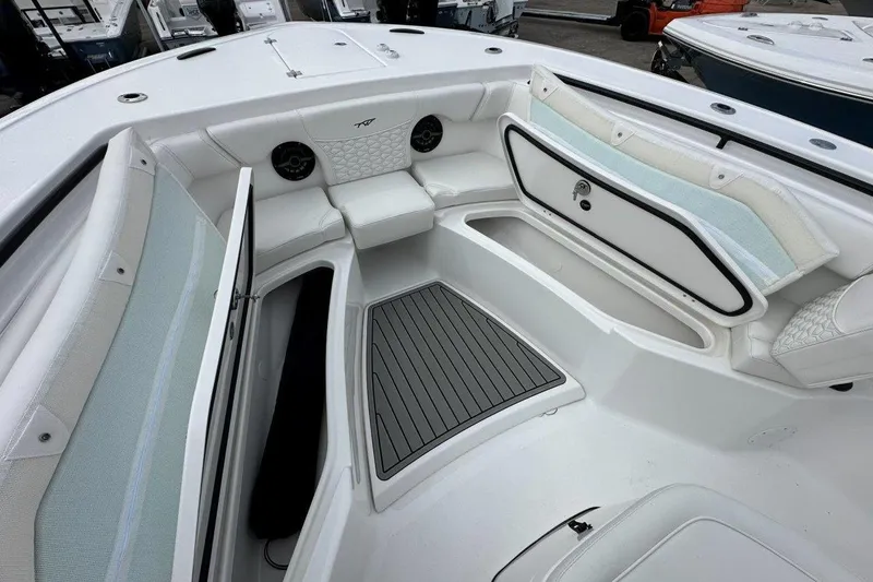 Slide: The Image of 2026 Tidewater 272 LXF boat interior with seating and storage compartments. - 25