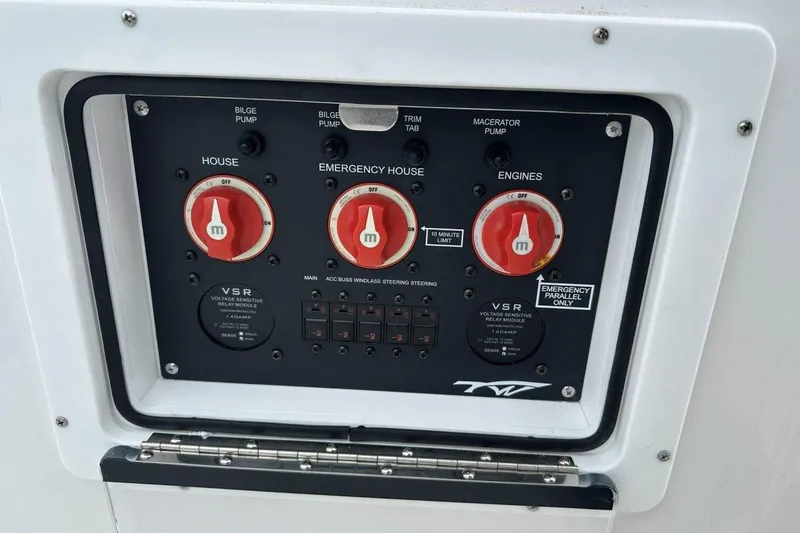 Slide: The Image of Control panel of 2026 Tidewater 272 LXF boat with emergency and engine switches. - 27